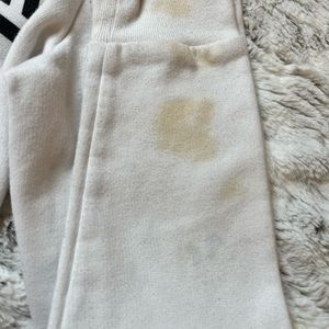 white victoria’s secret sweater with stains